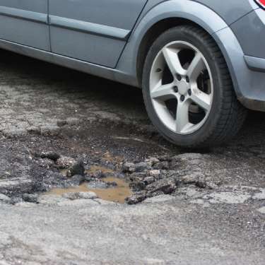 The Dangers of Potholes in Your Parking Lot